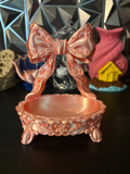 Vintage Bow & Filigree Jewellery Dish — example colour. Includes: One finished printed item; display accessories excluded. Approximate dimensions (Width × Depth × Height): 1 supplied: 152.4 × 106 × 177.4 mm.