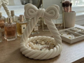 Twisted Rope Bow Jewellery Catchall — example colour. Includes: One finished printed item; display accessories excluded. Approximate dimensions (Width × Depth × Height): 1 supplied: 127.1 × 127 × 132.2 mm.