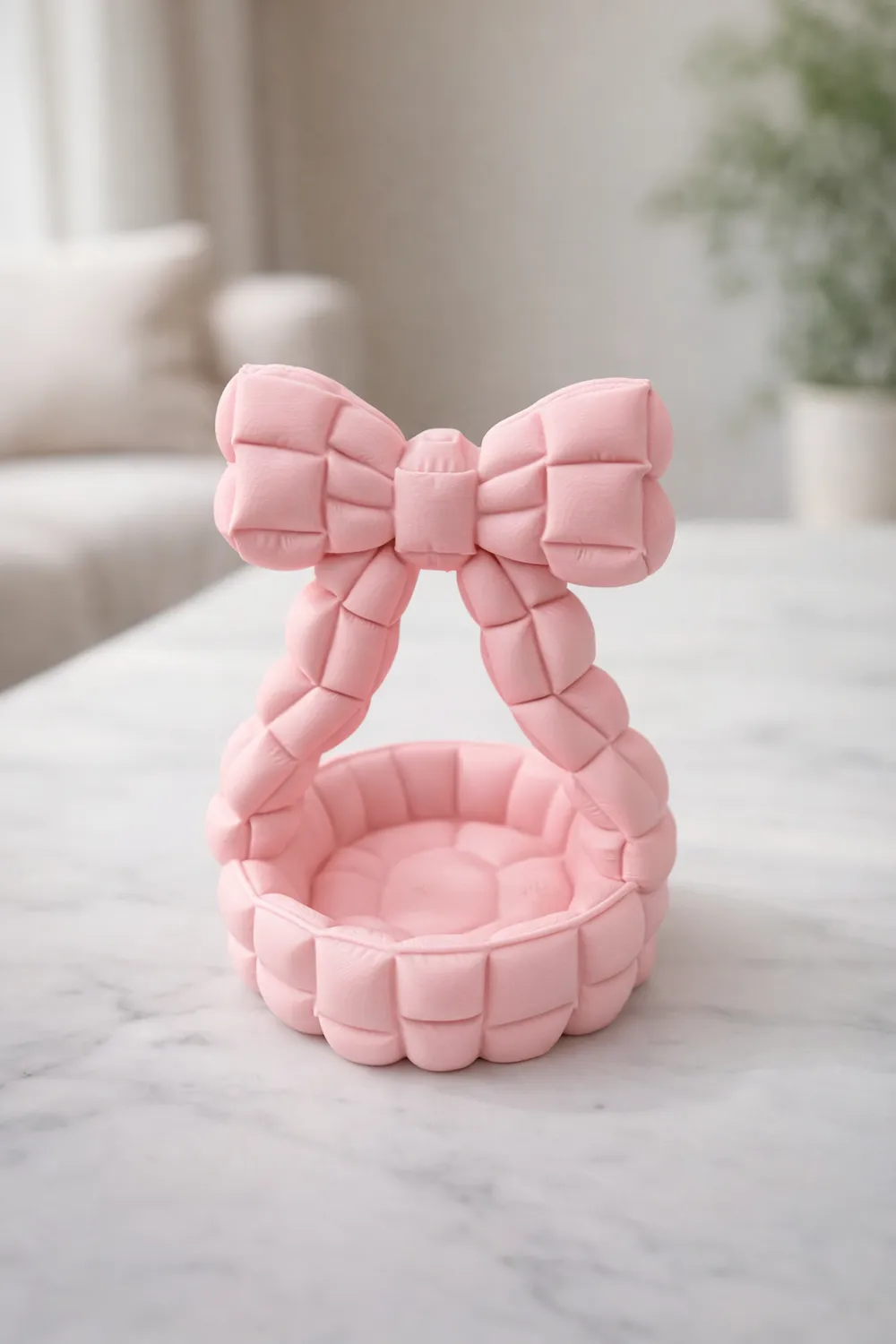 Quilted Bow Handle Catchall Basket — example colour. Includes: One finished item supplied; display accessories are excluded. Approximate dimensions (Width × Depth × Height): 1 supplied: 101.6 × 99.8 × 130.7 mm.