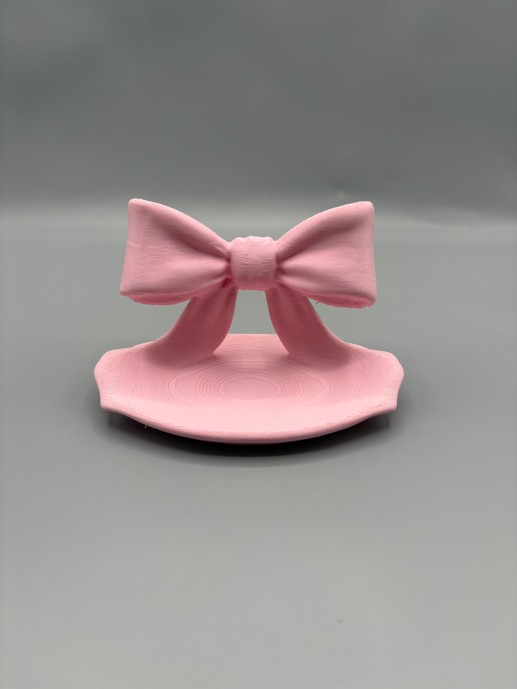 Ribbon Bow LED Tea Light Holder — example colour. Includes: One finished item supplied; display accessories are excluded. Approximate dimensions (Width × Depth × Height): 1 supplied: 101.6 × 65.3 × 64 mm.