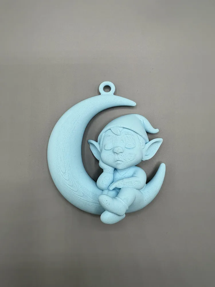 Sleeping Elf Crescent Moon Ornament — example colour. Includes: One finished item supplied; display accessories are excluded. Approximate dimensions (Width × Depth × Height): 1 supplied: 88.9 × 78 × 42.6 mm.