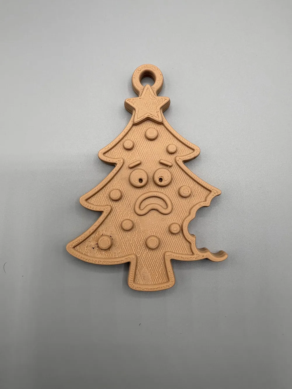 Bitten Christmas Tree Hanging Ornament — example colour. Includes: One finished item supplied; display accessories are excluded. Approximate dimensions (Width × Depth × Height): 1 supplied: 101.6 × 70.1 × 10.2 mm.
