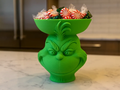 Grinning Holiday Creature Pedestal Bowl — example colour. Includes: One finished item supplied; display accessories are excluded. Approximate dimensions (Width × Depth × Height): 1 supplied: 104.5 × 103.3 × 114.3 mm.