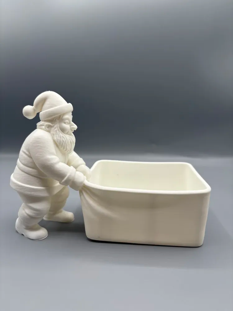 Santa Pulling Basket Wrapped-Treat Holder — example colour. Includes: One finished item supplied; display accessories are excluded. Approximate dimensions (Width × Depth × Height): 1 supplied: 186.8 × 88.9 × 136.1 mm.