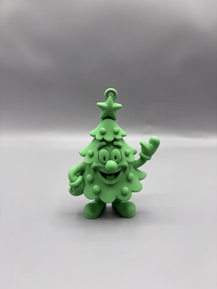 Cartoon Christmas Tree Hanging Ornament — example colour. Includes: One finished item supplied; display accessories are excluded. Approximate dimensions (Width × Depth × Height): 1 supplied: 101.6 × 73.5 × 25.4 mm.