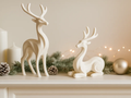 Minimalist Reindeer Pair Display Set — example colour. Includes: Two printed reindeer figures: one standing and one seated; display accessories excluded. Approximate dimensions (Width × Depth × Height): 1 supplied: 64.2 × 46.2 × 139.7 mm; 1 supplied: 75.3 × 50.5 × 101.2 mm.
