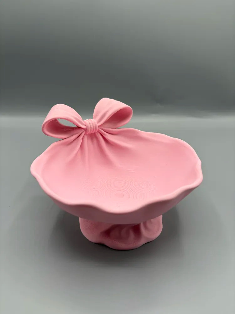 Ribbon-Wrapped Bow Catchall Bowl — example colour. Includes: One finished item supplied; display accessories are excluded. Approximate dimensions (Width × Depth × Height): 1 supplied: 129.9 × 127 × 84.3 mm.