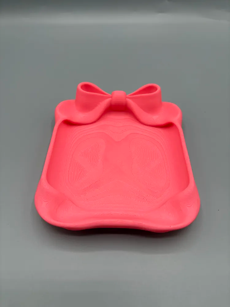 Bow Accent Jewellery Catchall Tray — example colour. Includes: One finished item supplied; display accessories are excluded. Approximate dimensions (Width × Depth × Height): 1 supplied: 152.4 × 128 × 32.8 mm.