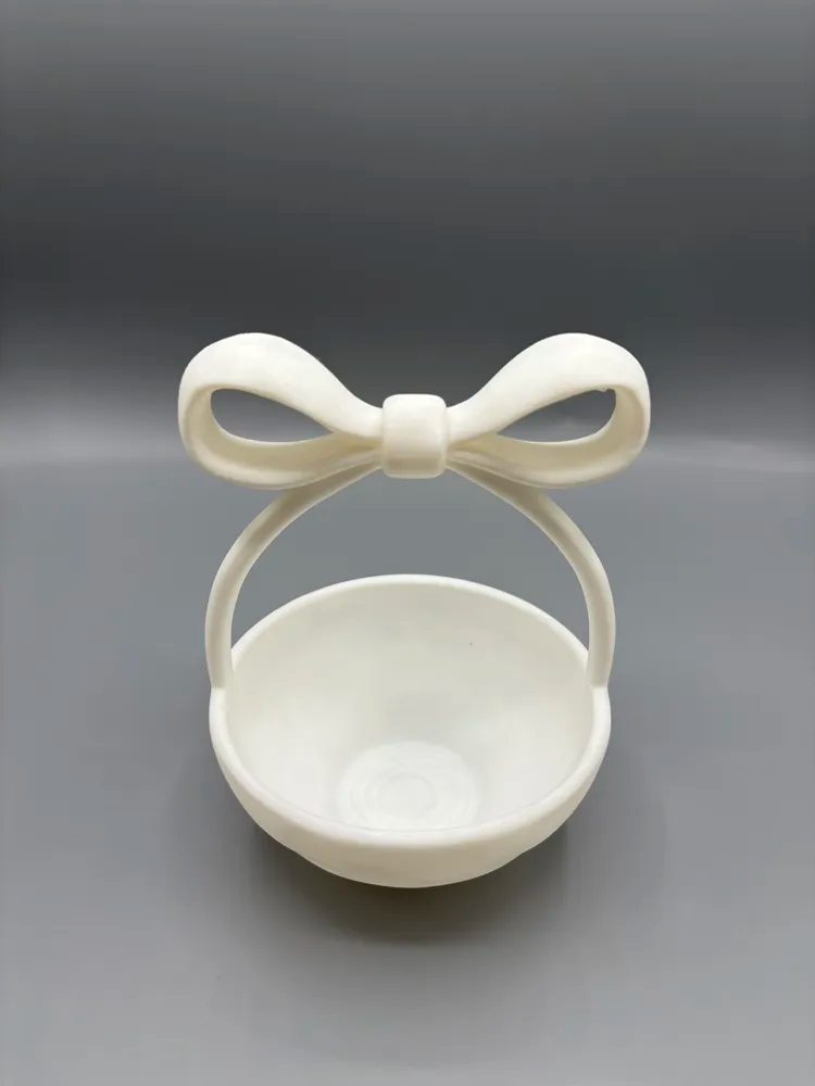 Bow Handle Rounded Catchall Bowl — example colour. Includes: One finished item supplied; display accessories are excluded. Approximate dimensions (Width × Depth × Height): 1 supplied: 127 × 126.5 × 166.4 mm.