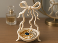 Ribbon-Leg Bow Jewellery Catchall — example colour. Includes: One finished item supplied; display accessories are excluded. Approximate dimensions (Width × Depth × Height): 1 supplied: 100.1 × 98.5 × 175.6 mm.