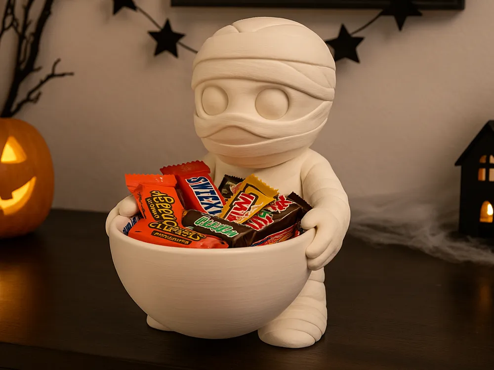 Mummy Halloween Wrapped-Treat Holder — example colour. Includes: One finished item supplied; display accessories are excluded. Approximate dimensions (Width × Depth × Height): 1 supplied: 148.9 × 121.5 × 177.8 mm.