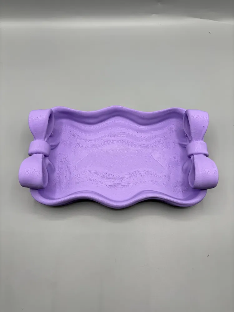 Twin Bow Accent Vanity Tray — example colour. Includes: One finished item supplied; display accessories are excluded. Approximate dimensions (Width × Depth × Height): 1 supplied: 177.8 × 113.3 × 46.2 mm.