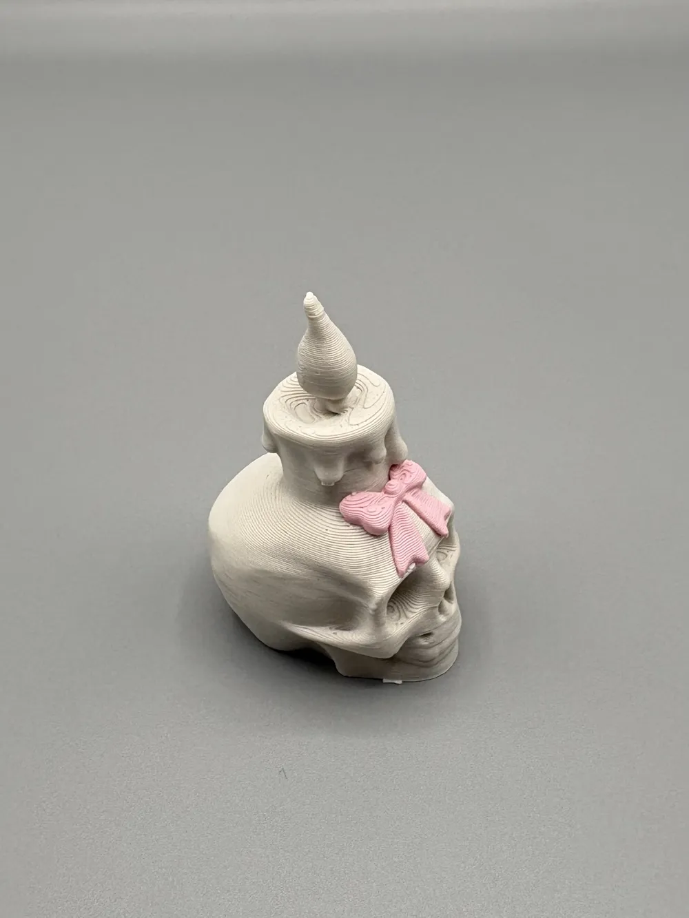 Skull Candle & Bow Decorative Figurine — example colour. Includes: One finished item supplied; display accessories are excluded. Approximate dimensions (Width × Depth × Height): 1 supplied: 36.1 × 26.3 × 50.8 mm.