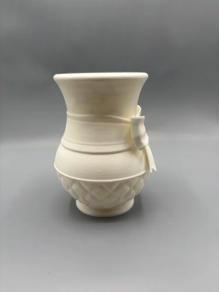 Quilted Spring Bow Decorative Vase — example colour. Includes: One finished item supplied; display accessories are excluded. Approximate dimensions (Width × Depth × Height): 1 supplied: 135.7 × 134.4 × 177.8 mm.