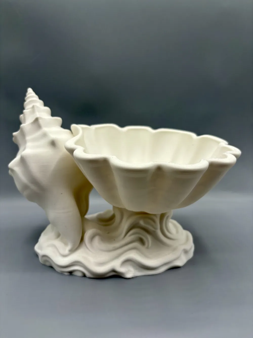Conch Spire Coastal Catchall Bowl — example colour. Includes: One finished item supplied; display accessories are excluded. Approximate dimensions (Width × Depth × Height): 1 supplied: 188.2 × 146.5 × 143.6 mm.