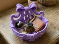 Flowing Ribbon Bow Catchall Basket — example colour. Includes: One finished item supplied; display accessories are excluded. Approximate dimensions (Width × Depth × Height): 1 supplied: 165.1 × 133.9 × 126.9 mm.