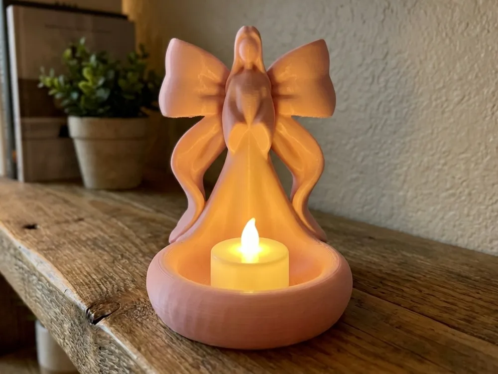 Ribbon Wing Angel LED Tea Light Holder — example colour. Includes: One finished item supplied; display accessories are excluded. Approximate dimensions (Width × Depth × Height): 1 supplied: 104.4 × 88.9 × 106.7 mm.