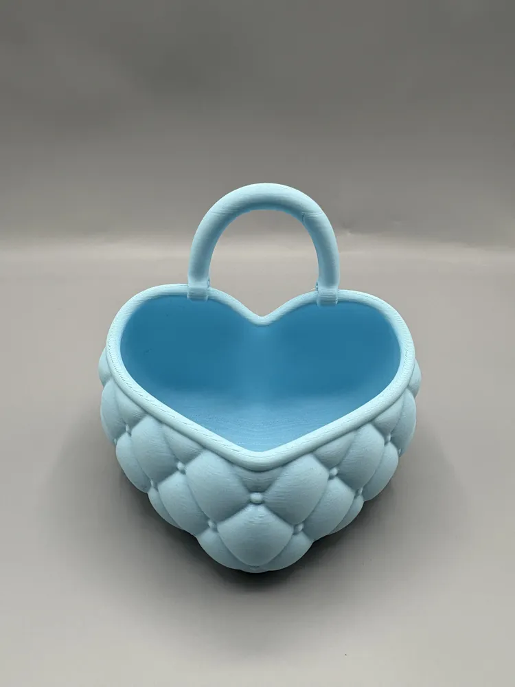 Quilted Heart Vanity Basket with Handle — example colour. Includes: One finished item supplied; display accessories are excluded. Approximate dimensions (Width × Depth × Height): 1 supplied: 174.3 × 152.6 × 163.1 mm.