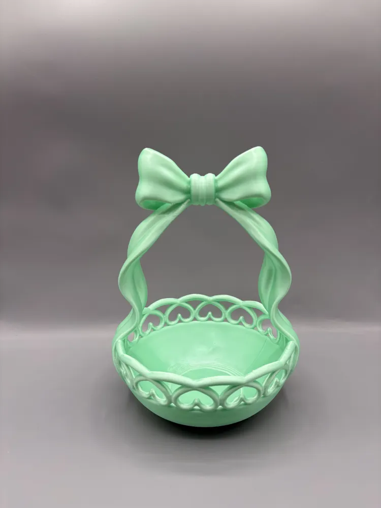 Heart Cutout Bow Handle Vanity Basket — example colour. Includes: One finished item supplied; display accessories are excluded. Approximate dimensions (Width × Depth × Height): 1 supplied: 146.8 × 145.1 × 202 mm.