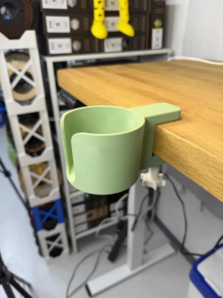 Clamp-On Cup Holder — example colour. Includes: one clamp-on cup holder. Approximate dimensions (Width × Depth × Height): 1 supplied: 99.9 × 157.5 × 77 mm; 1 supplied: 42 × 37 × 66.9 mm; 1 supplied: 37.2 × 37.2 × 7.2 mm.