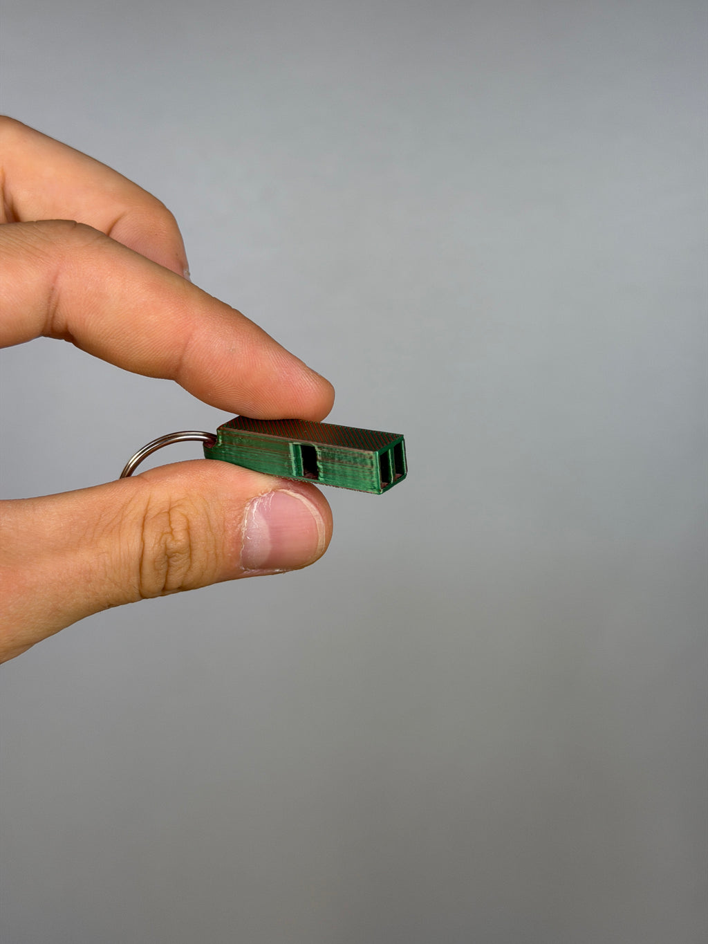Mini Dual Chamber Whistle - Pack of 10 — example photo. Pack contains ten printed whistles; pictured accessories are not included.