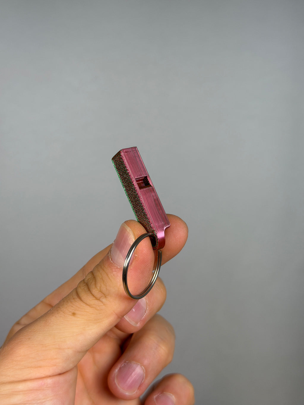 Mini Dual Chamber Whistle - Pack of 10 — example photo. Pack contains ten printed whistles; pictured accessories are not included.