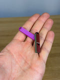 Mini Compact Whistle - Pack of 10 — example photo. Pack contains ten printed whistles; pictured accessories are not included.