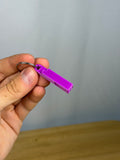Mini Headache Whistle - Pack of 10 — example photo. Pack contains ten printed whistles; pictured accessories are not included.