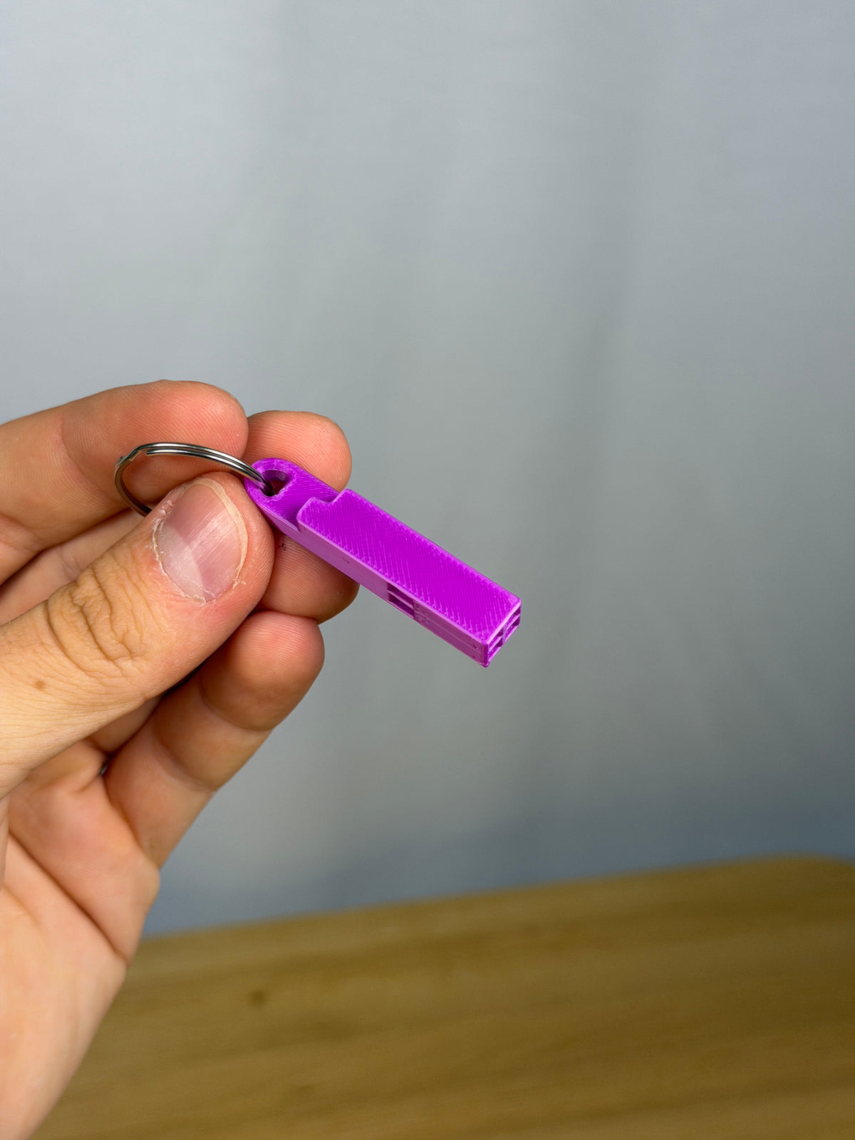Mini Headache Whistle - Pack of 10 — example photo. Pack contains ten printed whistles; pictured accessories are not included.