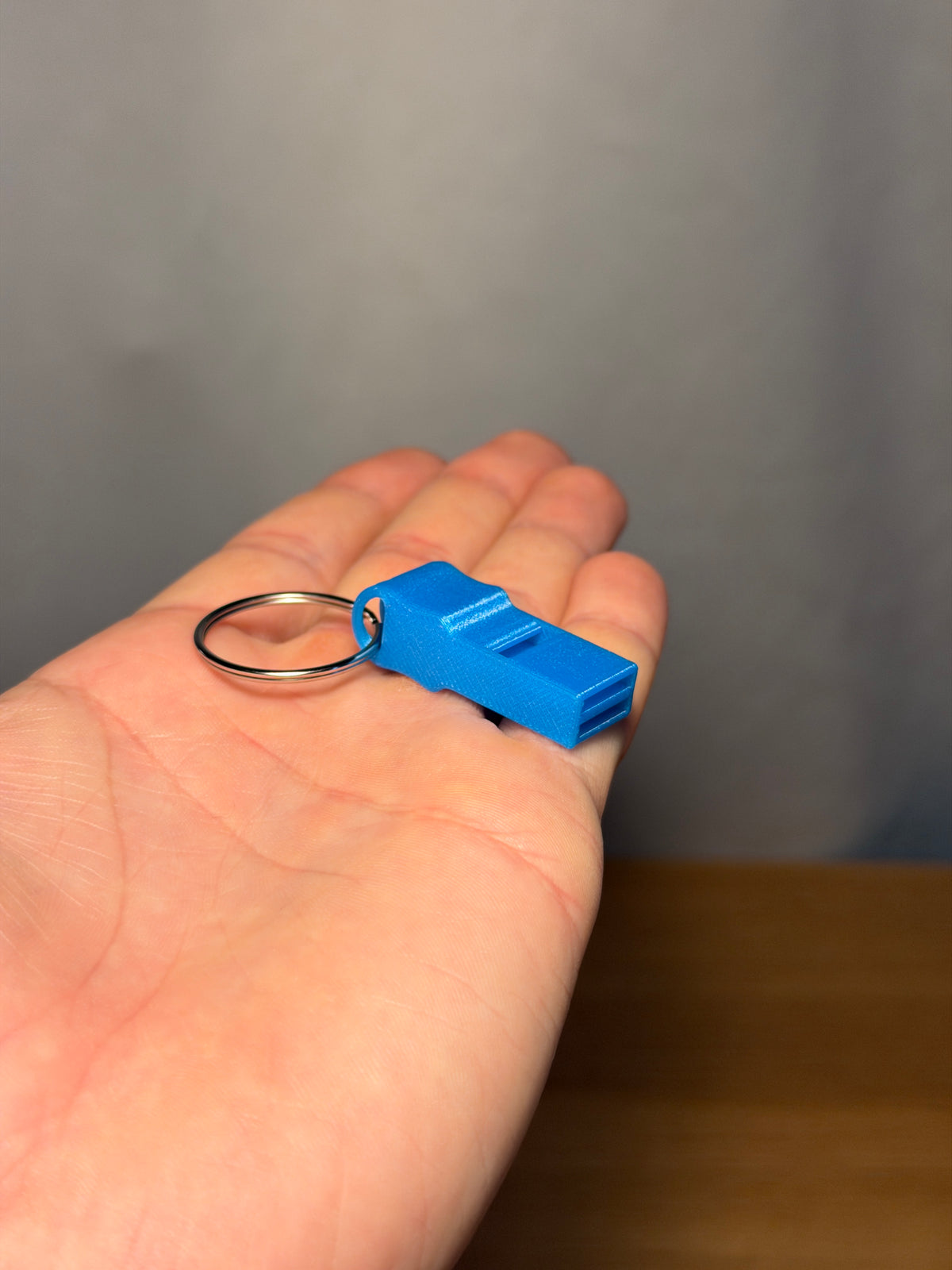 Mini Whistle - Pack of 10 — example photo. Pack contains ten printed whistles; pictured accessories are not included.