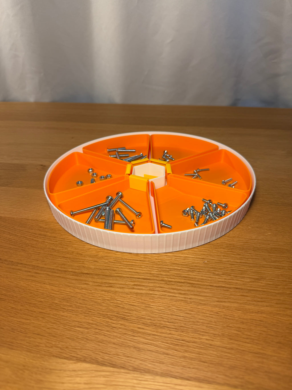 Stackable Modular Funnel Trays — creator design example. One set contains six funnel trays, six outlet stoppers and one round base. Screws, nuts and other stored hardware are demonstration props and are not included.