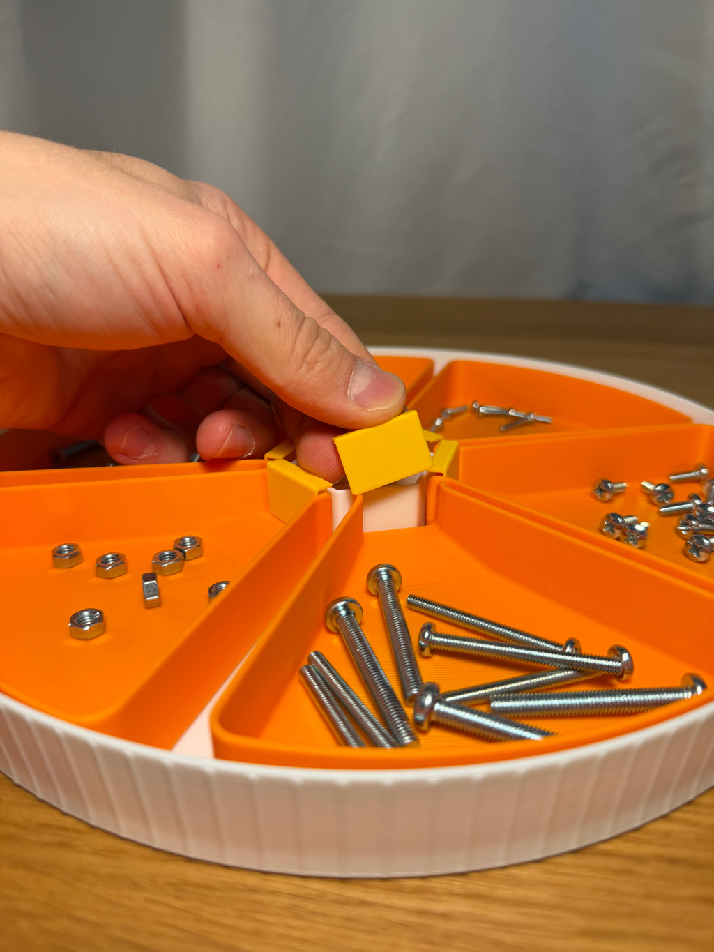 Stackable Modular Funnel Trays — creator design example. One set contains six funnel trays, six outlet stoppers and one round base. Screws, nuts and other stored hardware are demonstration props and are not included.