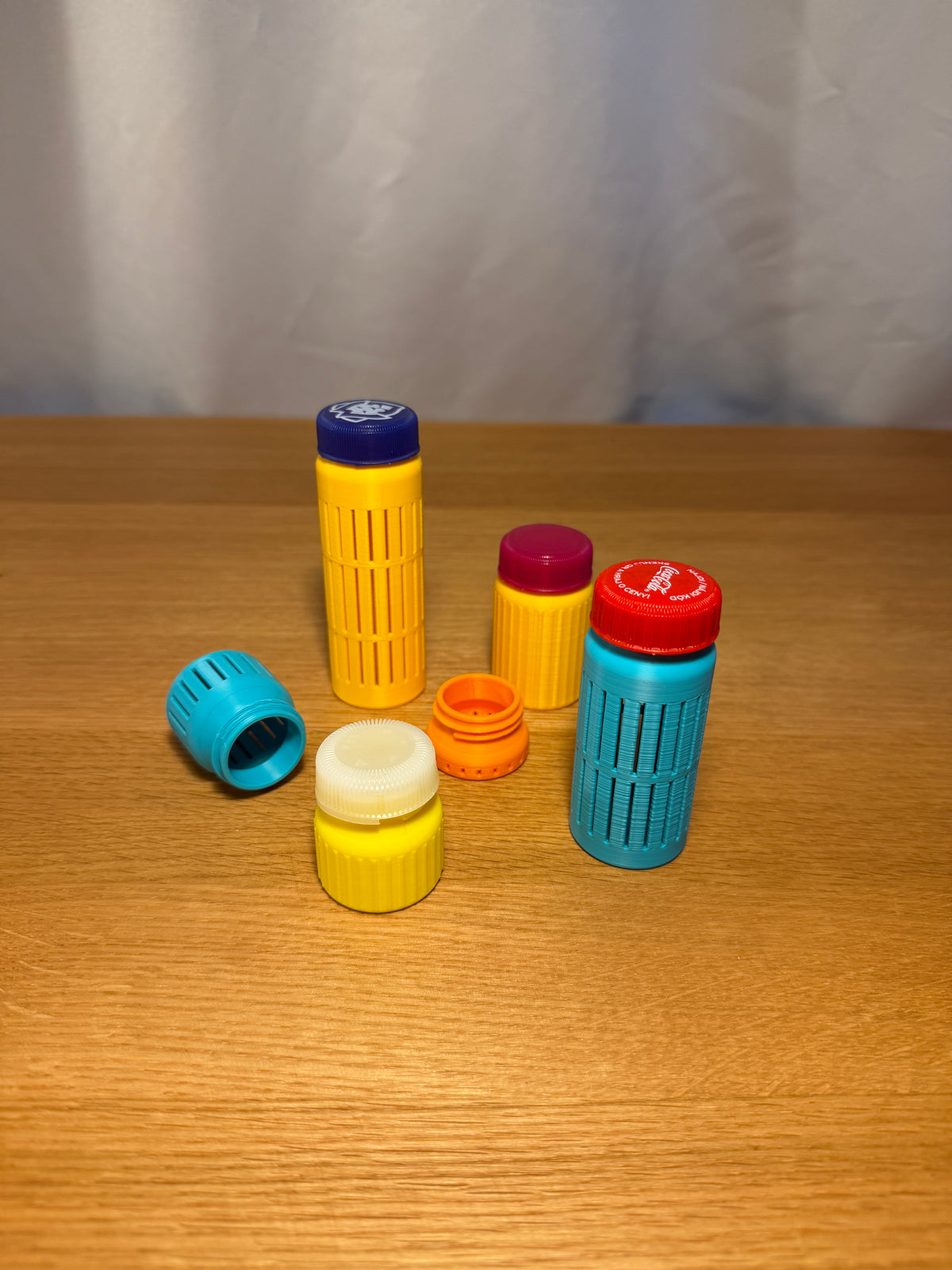 Example perforated printed containers with separate bottle caps