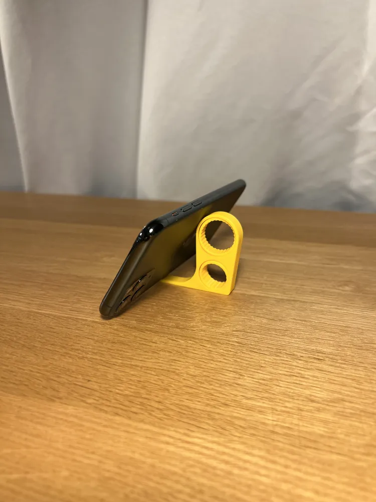 Phone Finger Holder - Pack of 5 — example colour. Includes: 5 printed pieces of the selected design. Approximate dimensions (Width × Depth × Height): 5 supplied: 67.6 × 53.6 × 10 mm.