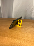Phone Finger Holder - Pack of 5 — example colour. Includes: 5 printed pieces of the selected design. Approximate dimensions (Width × Depth × Height): 5 supplied: 67.6 × 53.6 × 10 mm.