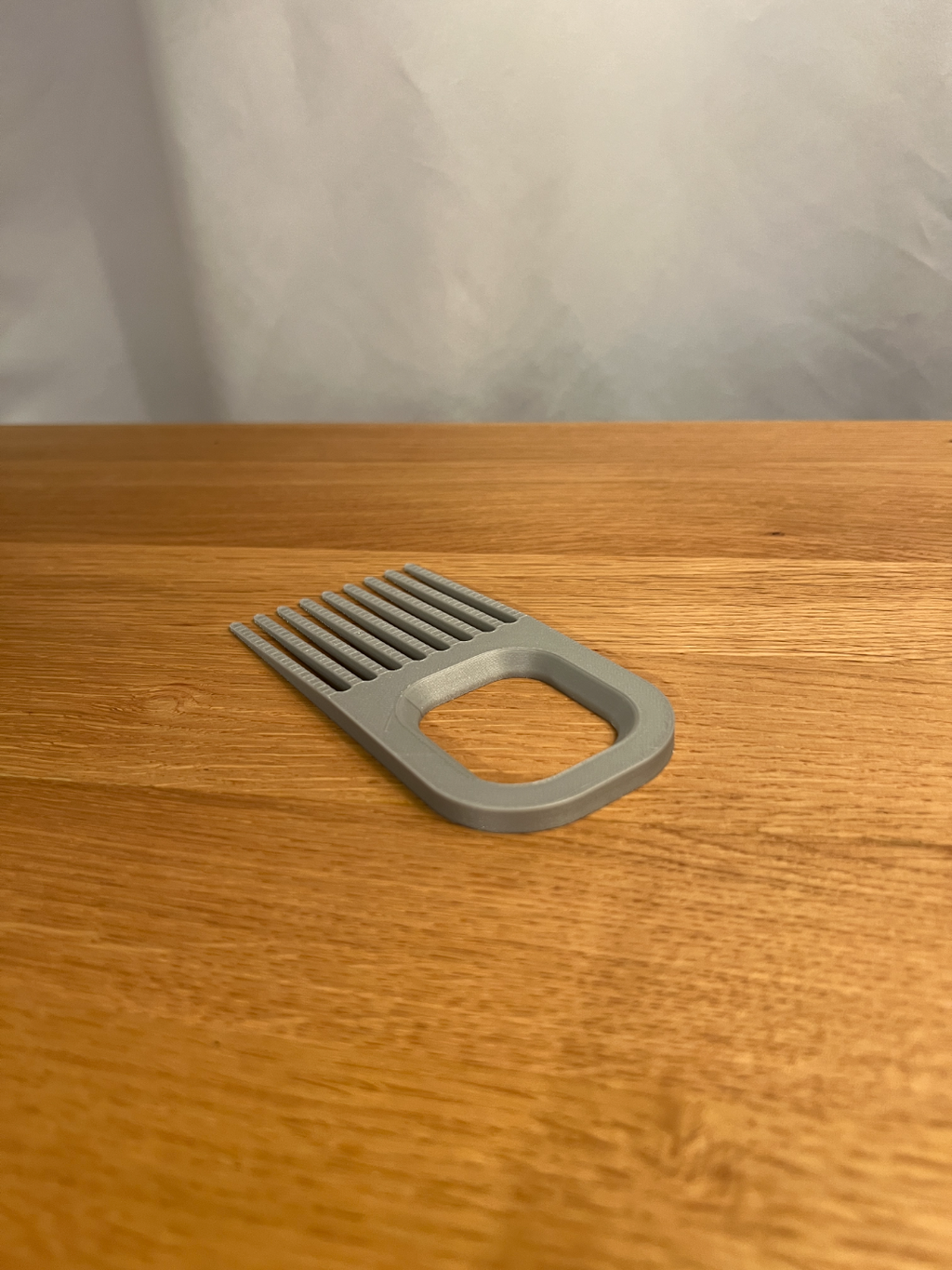 Reverse view of the wide printed hairbrush cleaner