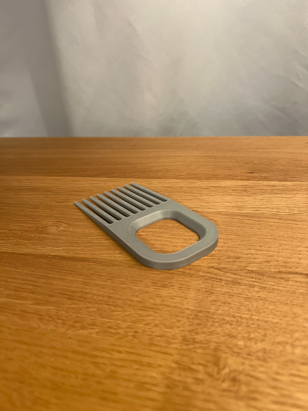 Reverse view of the wide printed hairbrush cleaner