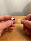 Printed earbud cleaning tool shown with an example earbud