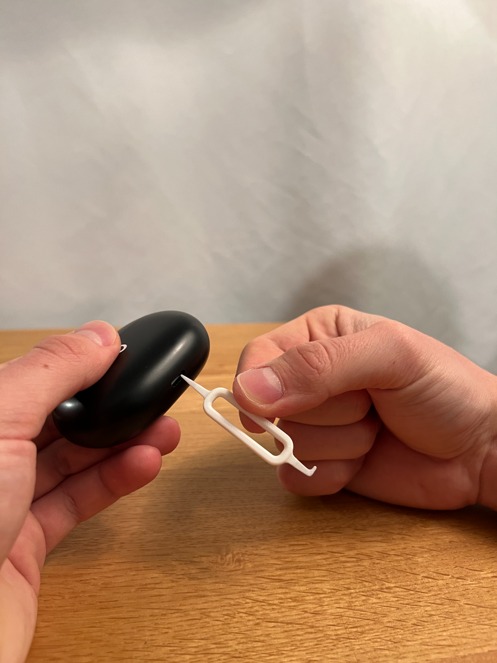 Printed USB-C port tool shown beside an example charging case