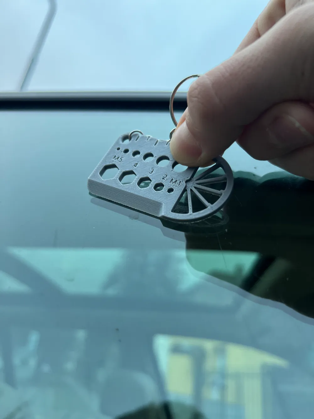 Ruler & Scraper Multi-Tool Keyring — example colour. Includes: one ruler & scraper multi-tool keyring. Approximate dimensions (W × D × H): • Ruler & Scraper Multi-Tool Keyring: 60 × 35 × 3 mm.