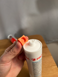 Orange printed cap shown beside an example silicone cartridge