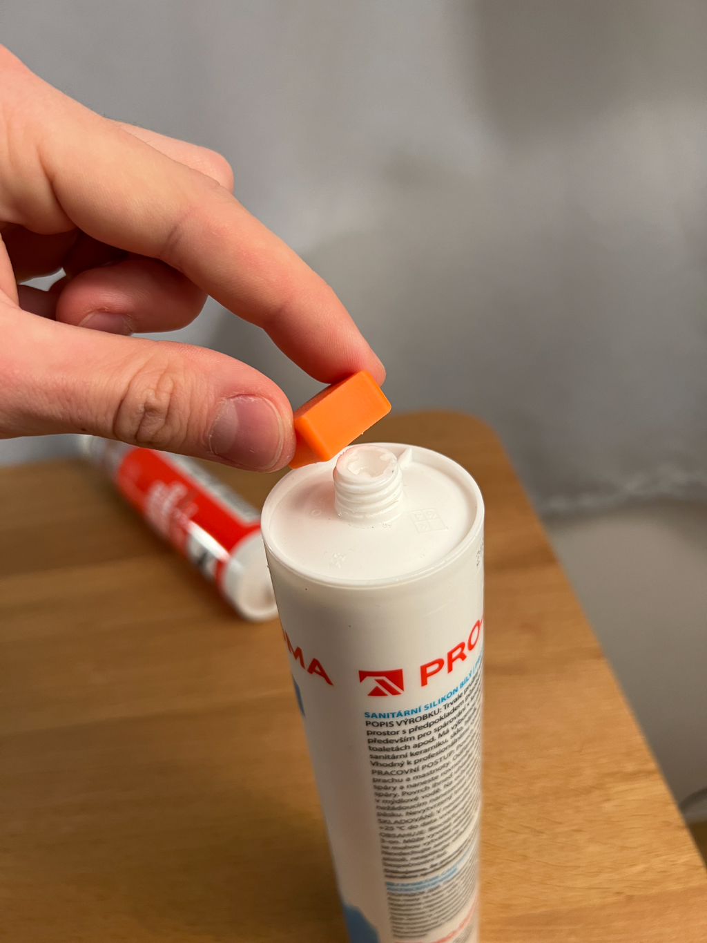 Orange 3D-printed cap shown above an example cartridge