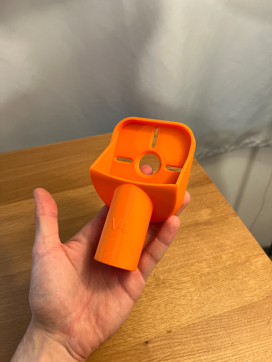 Printed V4 drill dust collector held in a hand