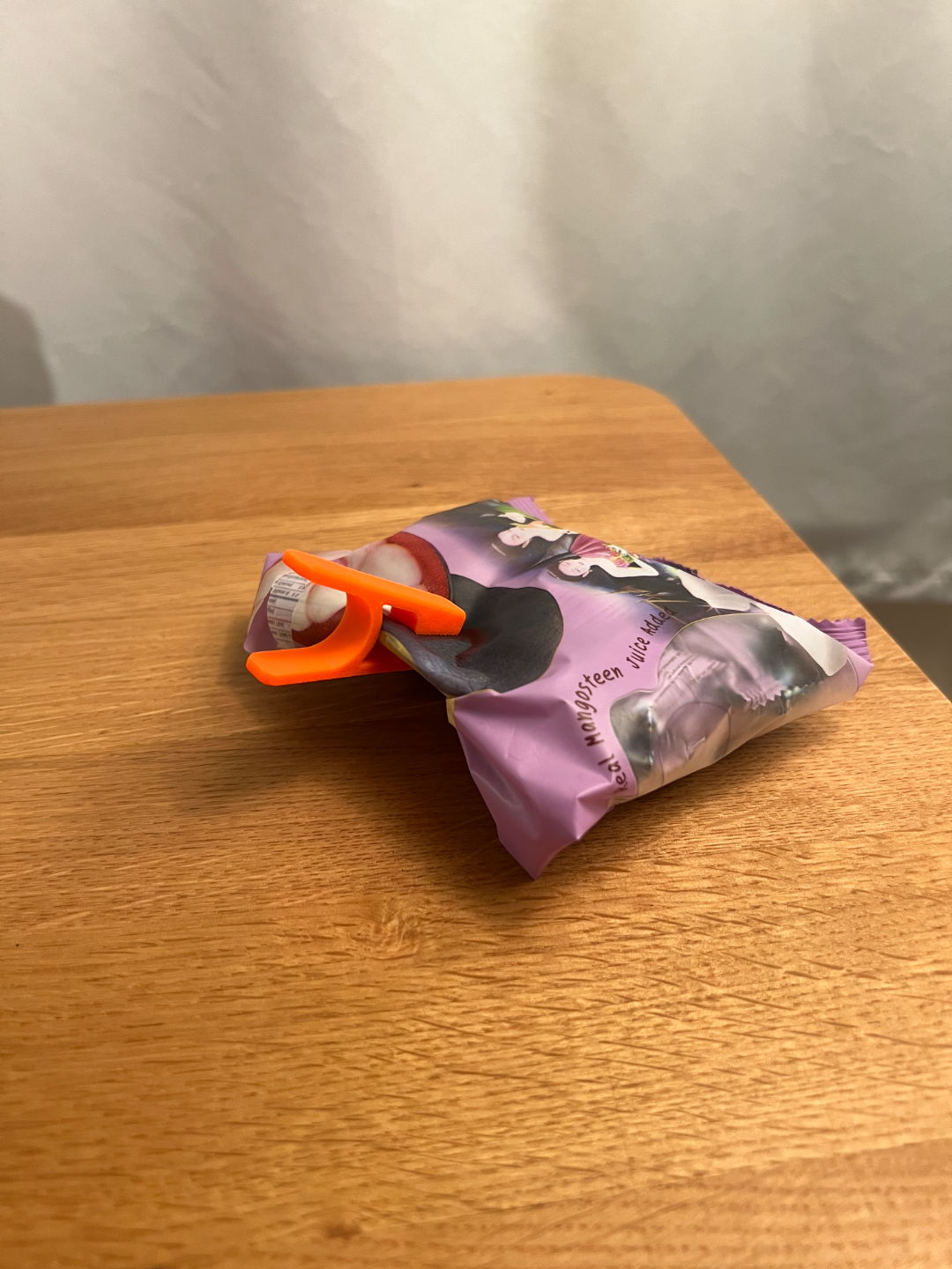 Mini printed clip on an example folded packet