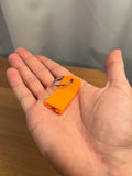 Beverage Can Opener — creator design example. One printed pull-tab opener is supplied. The metal keyring pictured and any beverage can are not included. Photos show a creator design example; selected colour and material may differ.