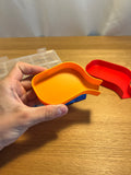 Small printed funnel tray in hand with a larger example behind