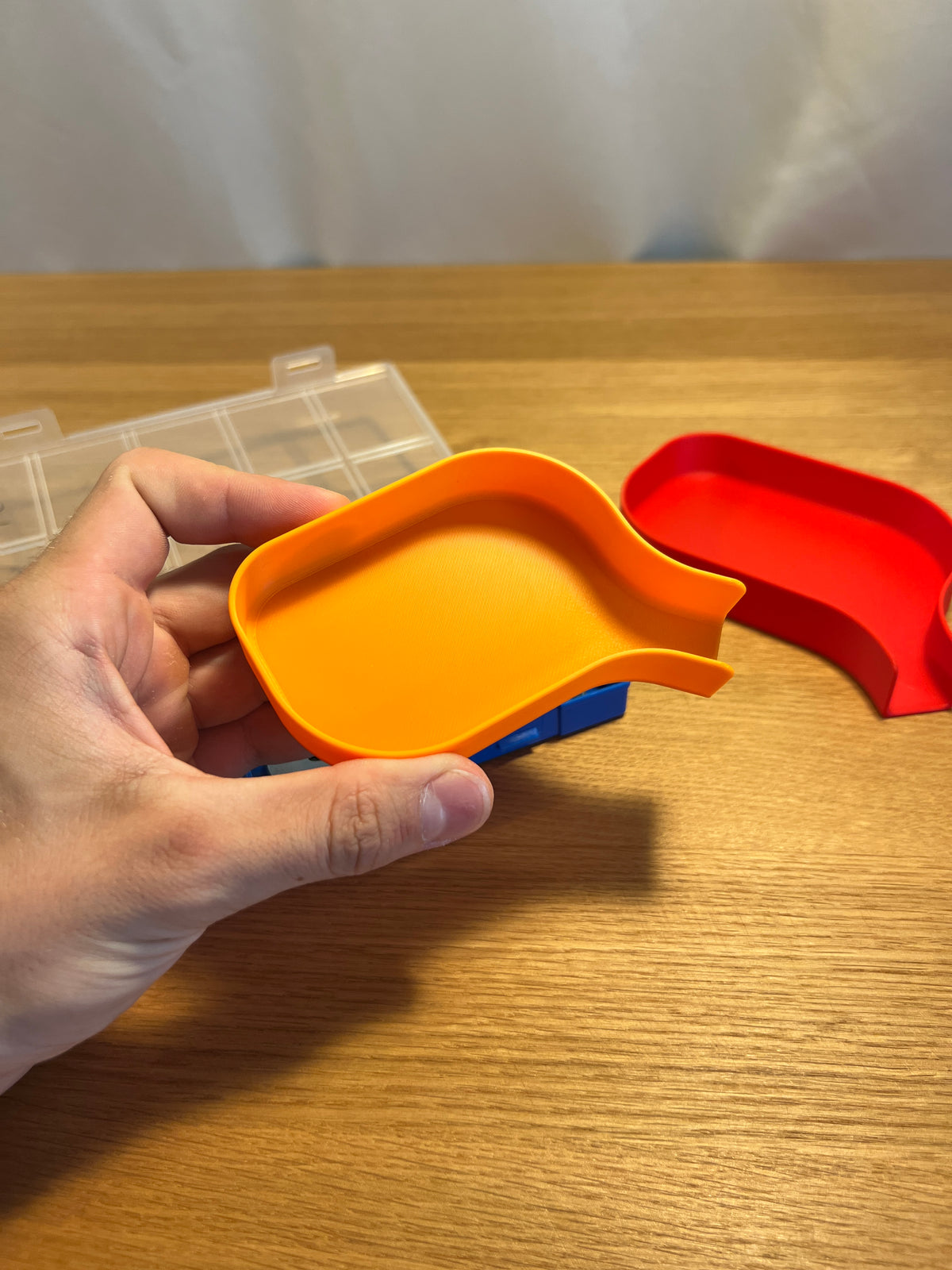 Small printed funnel tray in hand with a larger example behind